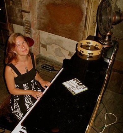 Colleen Newvine playing piano at Preservation Hall