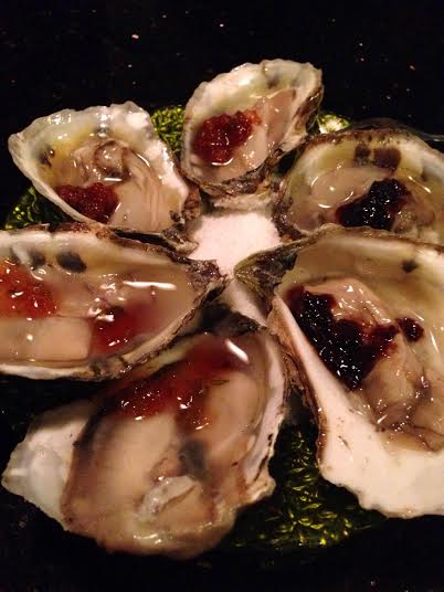 Desnuda oysters come topped with a dollop of three different sauces.