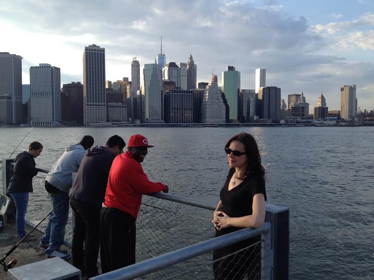 As John was taking pictures of my new hair, a guy flew his drone too low and it got tangled in the fishing lines of guys at Brooklyn Bridge Park. Here they're pulling his waterlogged drone out, to my great amusement.